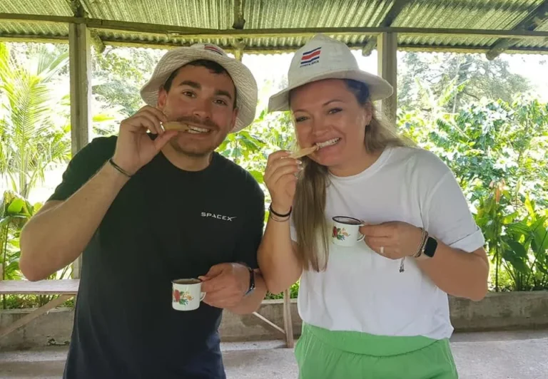 Two travelers tasting fresh chocolate and coffee on a farm tour near Tenorio Volcano, Costa Rica