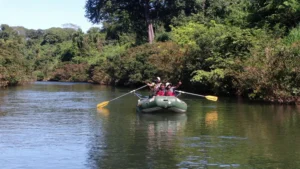 Guide pointing out wildlife from the raft, Guanacaste