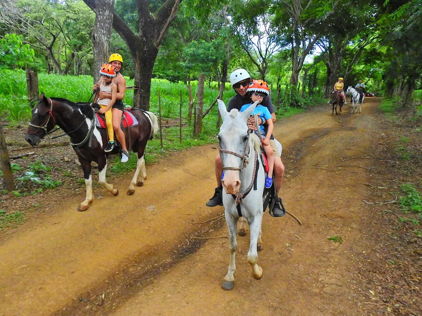 Parents and children on horseback on a family ride at Congo Trail, Guanacaste, Costa Rica