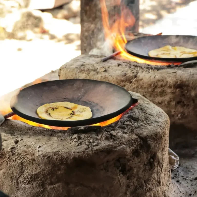 Tortillas cooking on a wood-fired comal, Hacienda El Viejo cultural tour, Guanacaste, Costa Rica