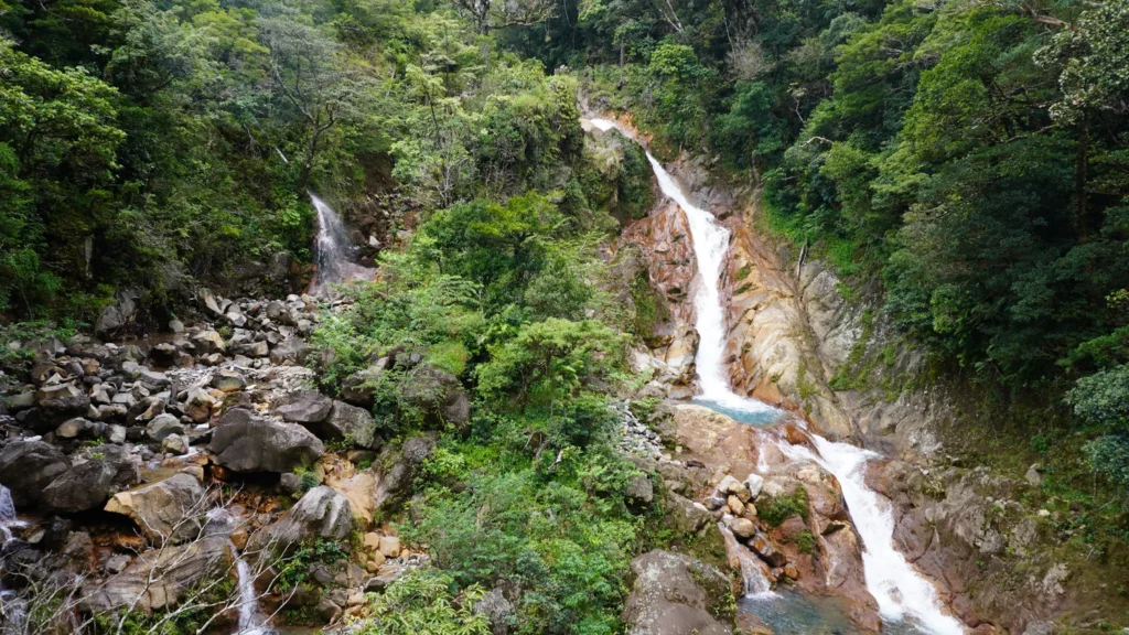 Multi-tier waterfall in a rainforest canyon near Miravalles Volcano on a Guanacaste waterfall tour