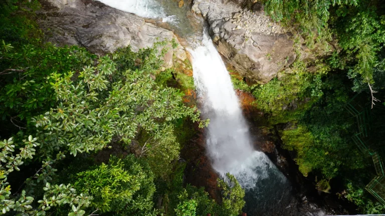 Aerial view of a waterfall plunging into a pool, hanging bridges waterfall tour Guanacaste