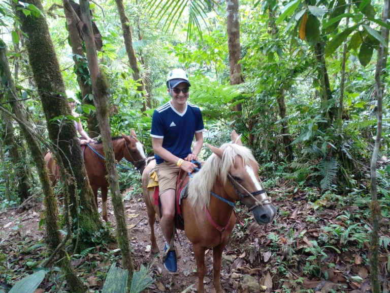 Rider on a forest trail through the rainforest on the slopes of Río Celeste, Tenorio, Costa Rica