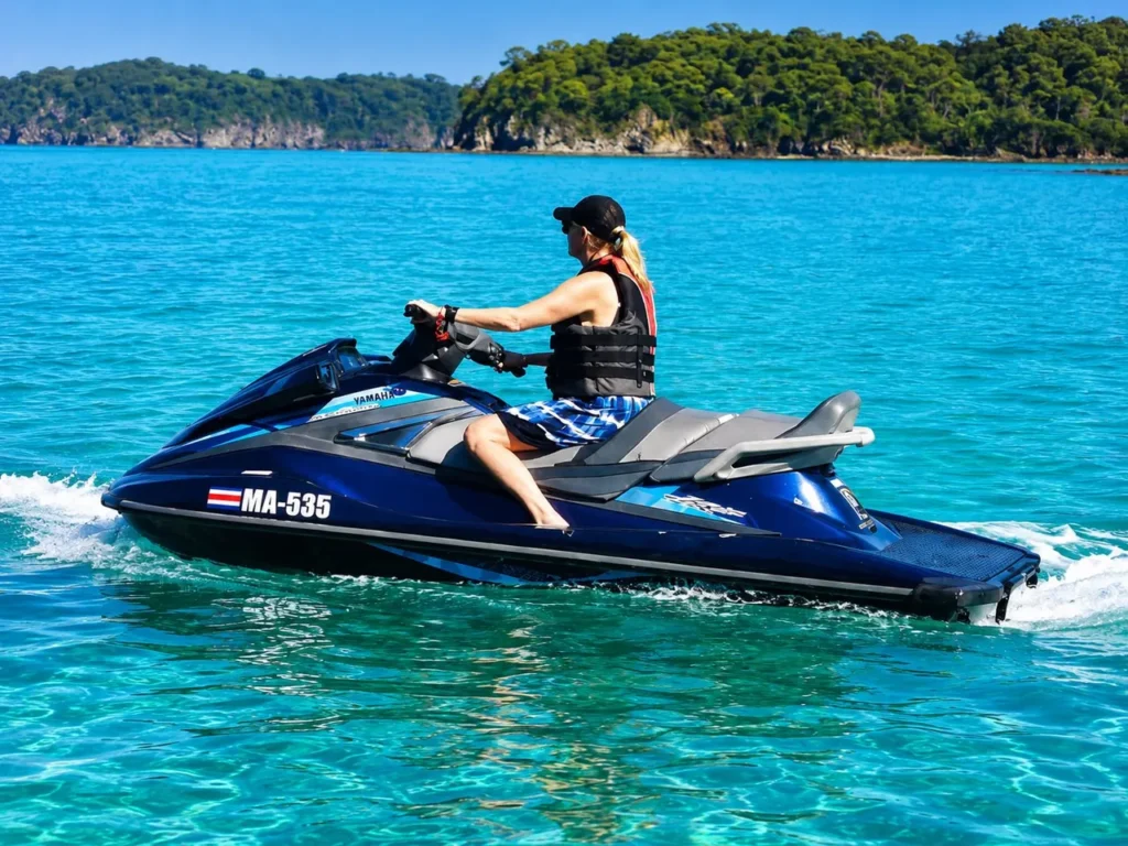 Rider on a jet ski cruising the clear water of the Gulf of Papagayo, Costa Rica