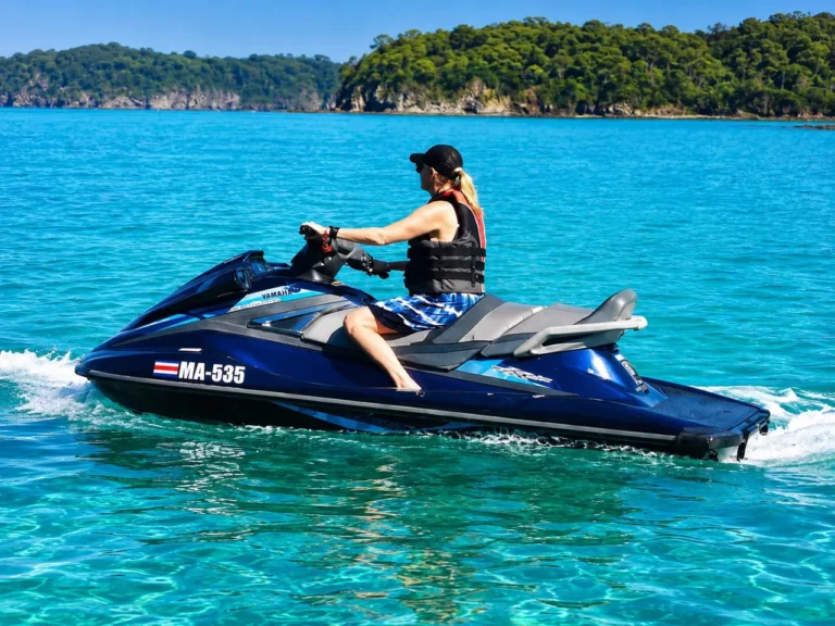 Rider on a jet ski cruising the clear water of the Gulf of Papagayo, Costa Rica