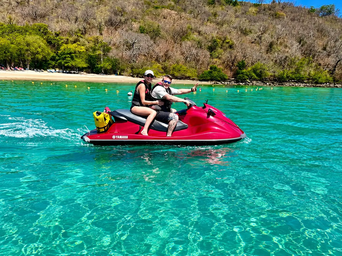 Couple riding a jet ski on the Gulf of Papagayo near Guanacaste, Costa Rica