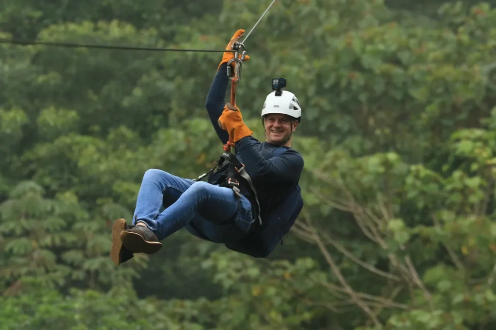 Smiling guest on a Monteverde cloud forest canopy zipline tour