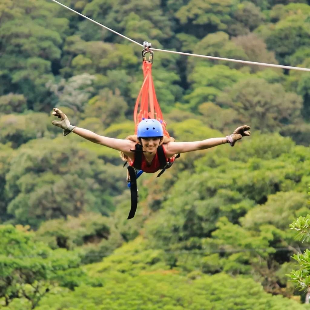 Visitor flying superman-style on a Monteverde cloud forest zipline tour