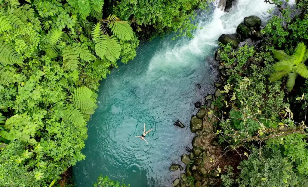 Aerial view of Rio Celeste turquoise river and waterfall, Costa Rica