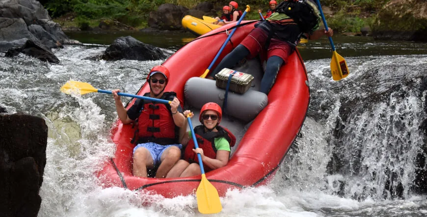 Couple white water rafting through rapids on the Tenorio River, Guanacaste