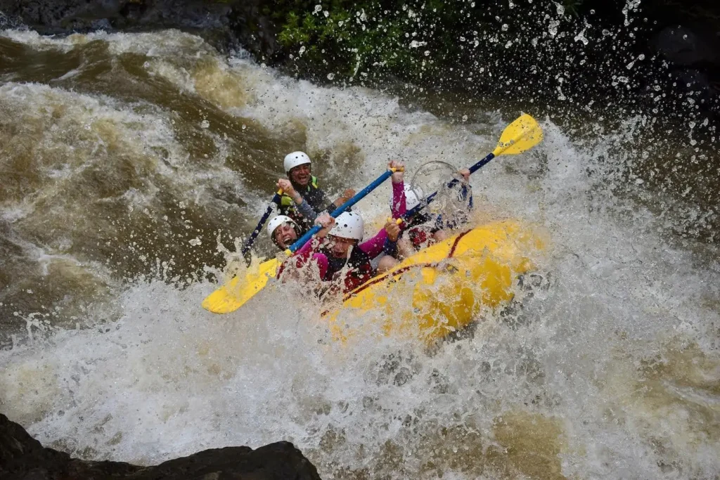 Rafting through a big rapid splash on the Tenorio River, Costa Rica
