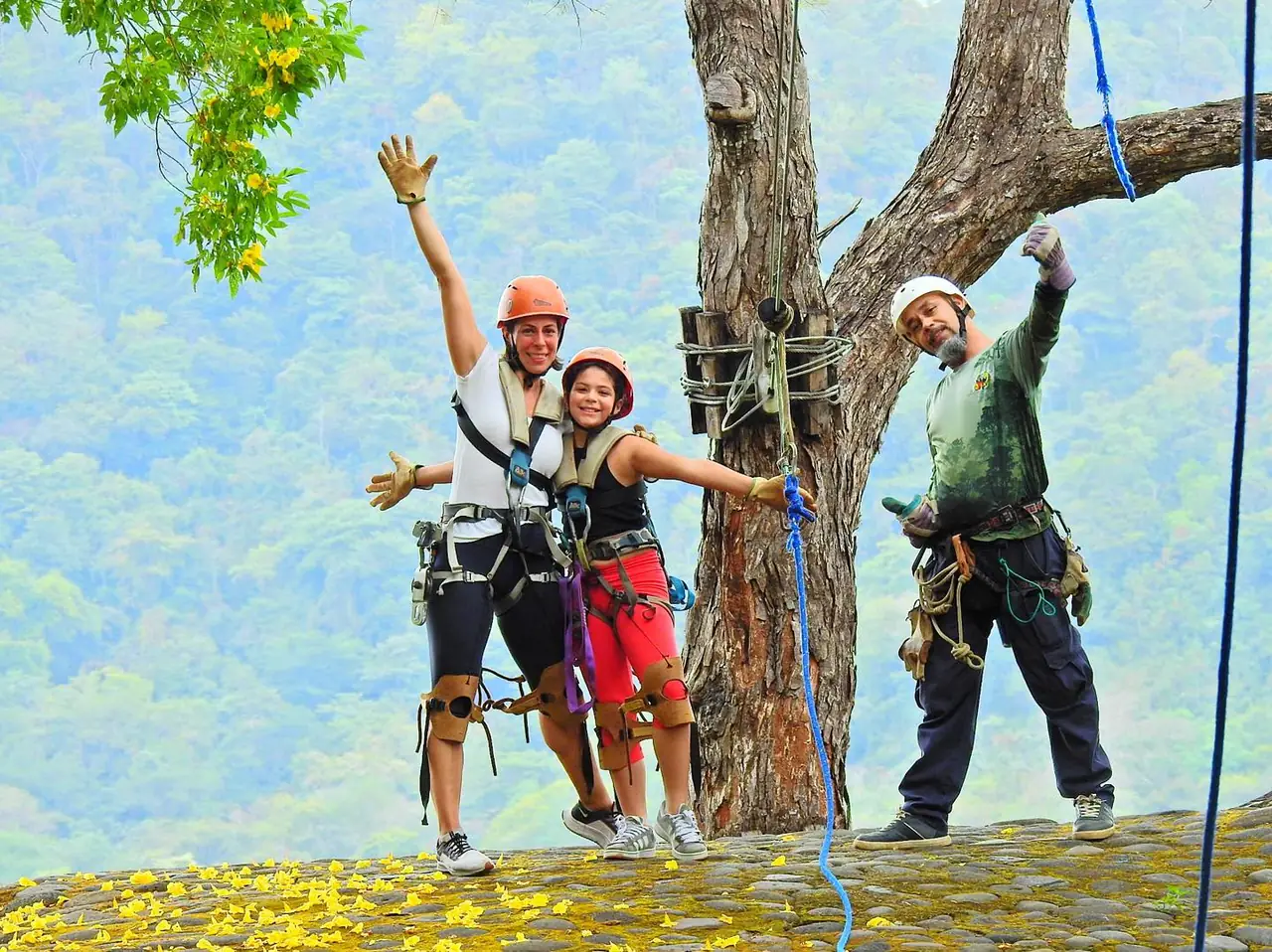 Family with a naturalist guide at a zip-line platform with mountain views in Guanacaste, Costa Rica
