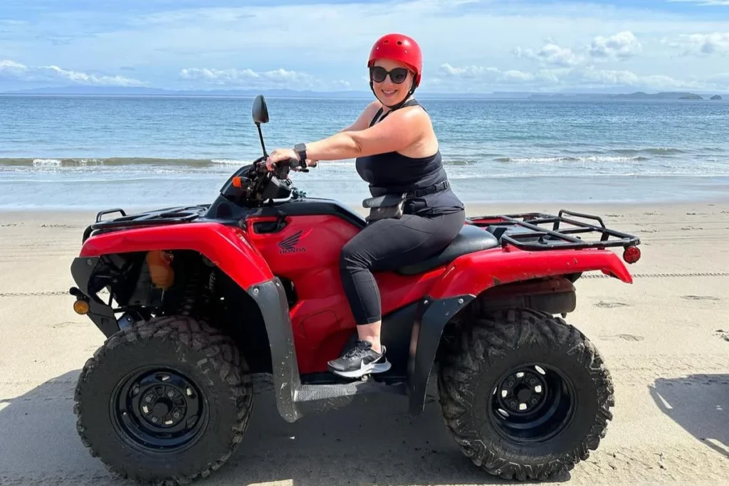Guest riding a Honda ATV on the beach with ocean views in Guanacaste, Costa Rica
