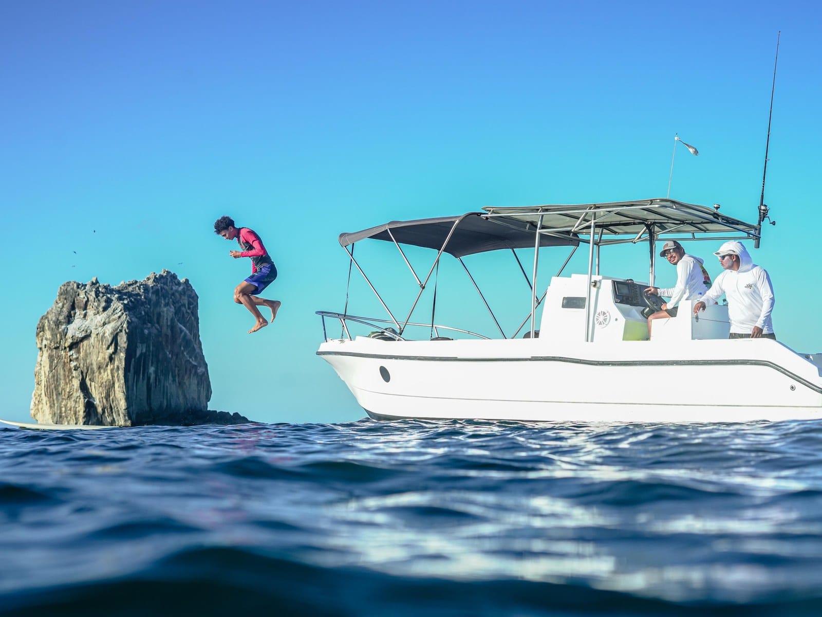 Twenty-five foot private charter boat with shade and open seating in the Gulf of Papagayo, Guanacaste, Costa Rica