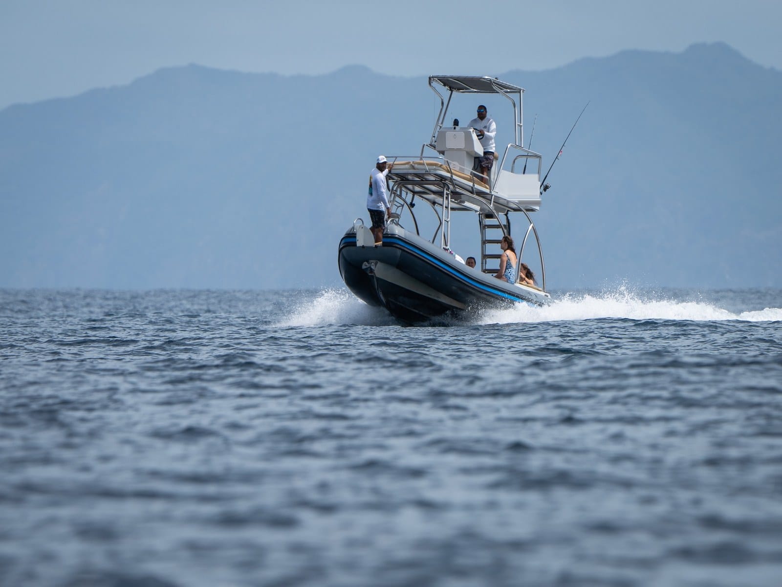 Rigid inflatable charter boat with a raised tower and shade in the Gulf of Papagayo, Guanacaste, Costa Rica