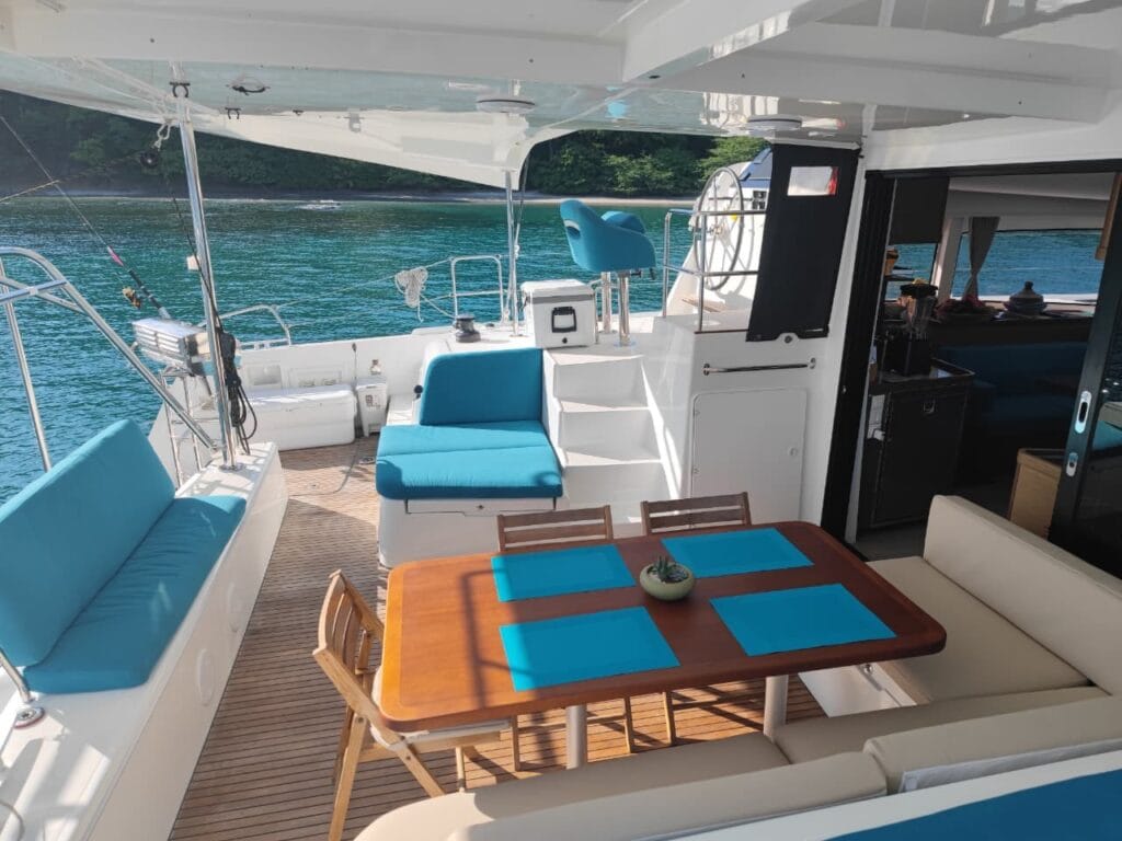 Table set for lunch on the deck of a private catamaran in the Gulf of Papagayo, Guanacaste, Costa Rica