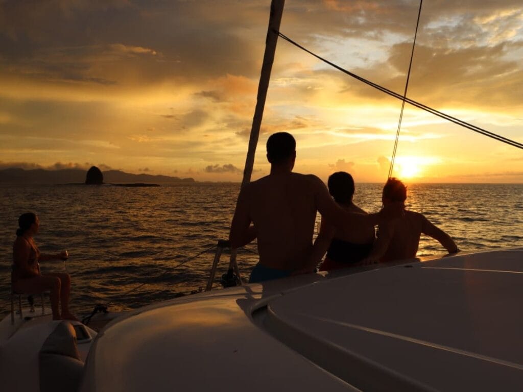 Guests watching the sunset from a private sailing catamaran in the Gulf of Papagayo, Guanacaste, Costa Rica