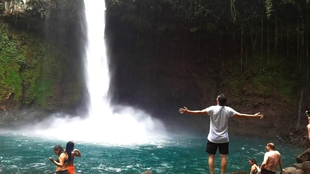 Visitors at the base of La Fortuna Waterfall, Costa Rica