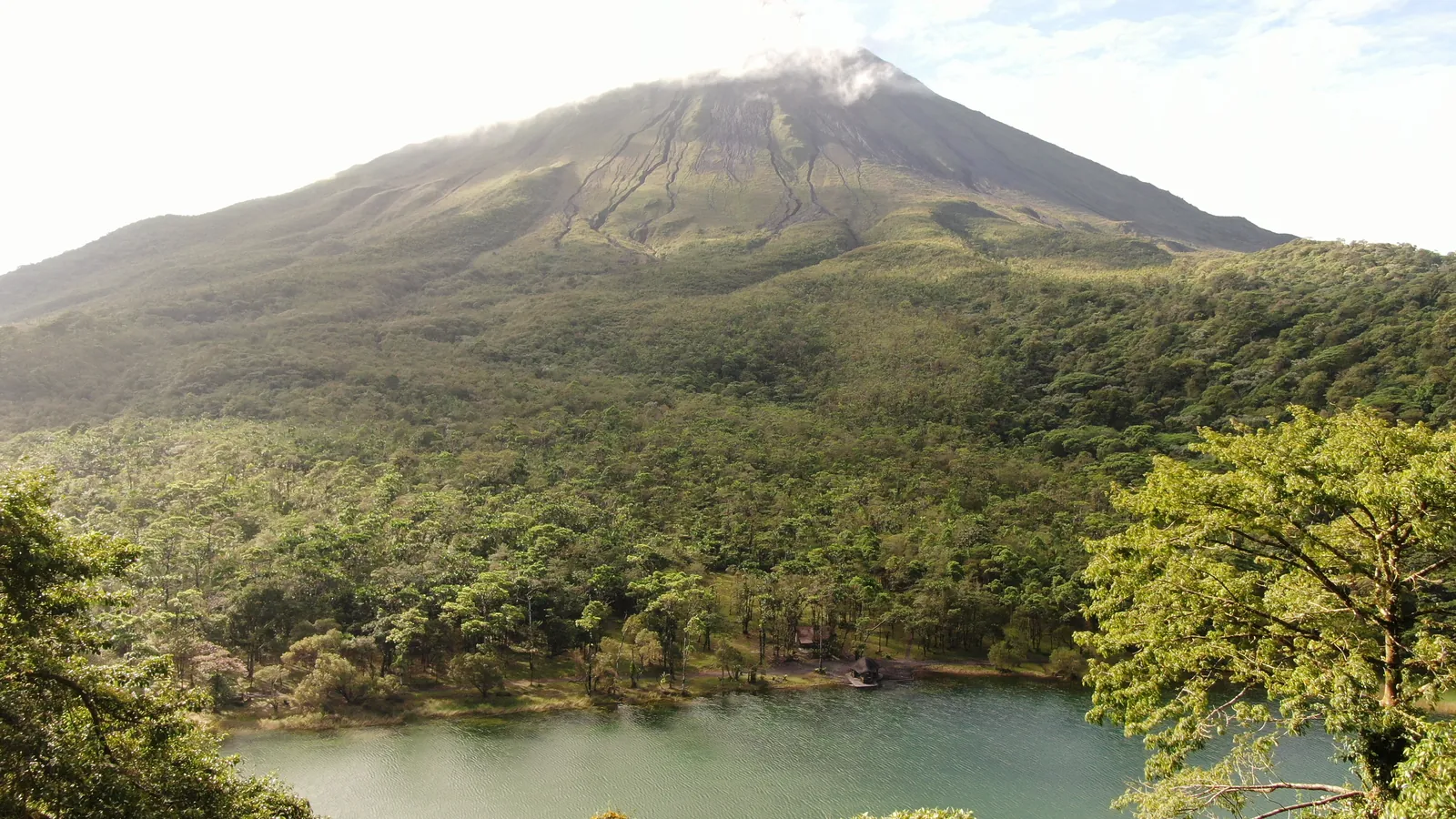 Arenal Volcano and rainforest with a lagoon in the foreground, Costa Rica