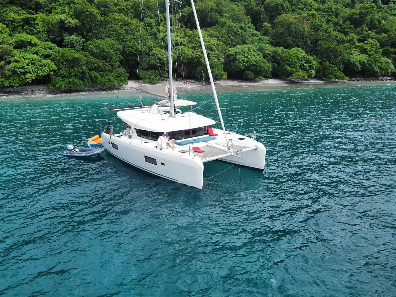 Private catamaran charter anchored in a turquoise cove of the Gulf of Papagayo, Guanacaste, Costa Rica